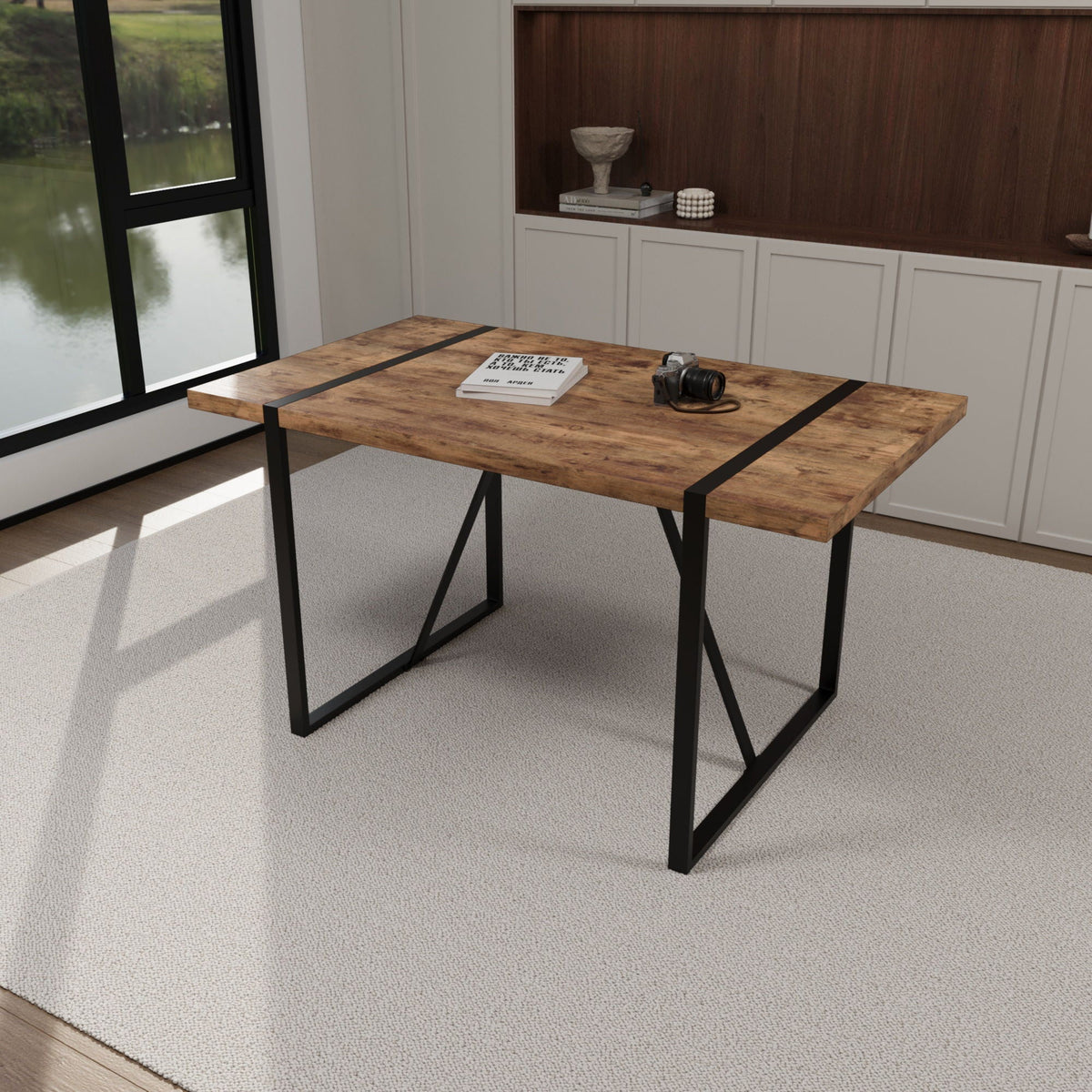 Rectangular light brown wood dining table with black metal frame and angular legs on Tampa Home & Garden Store