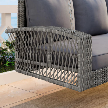 Gray wicker 3-person patio swing bench with dark cushions on outdoor deck by the sea on Tampa Home & Garden Store