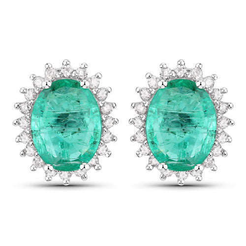 Pair of 14K white gold emerald and diamond halo stud earrings with vivid Zambian emeralds on Tampa Home & Garden Store
