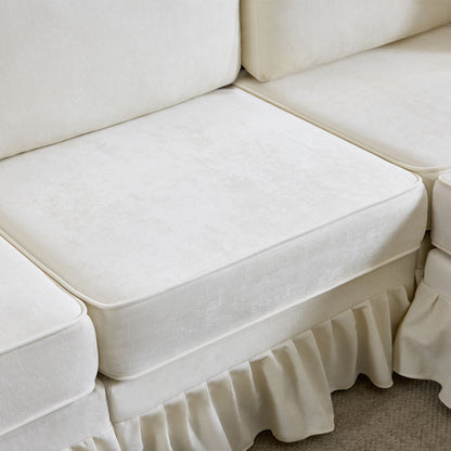 White fabric L-shaped sectional sofa with removable ruffled skirt and pleated base on Tampa Home & Garden Store