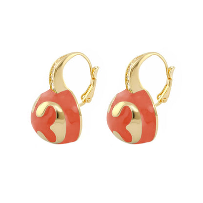 Gold-tone drop earrings with coral enamel circular pendant and gold scroll accents, pair on Tampa Home & Garden Store