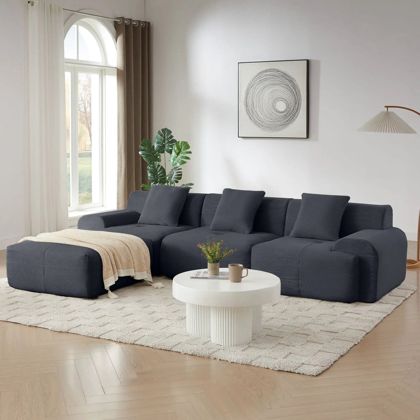 L-shaped modular sectional sofa with movable ottoman in dark navy fabric on Tampa Home & Garden Store