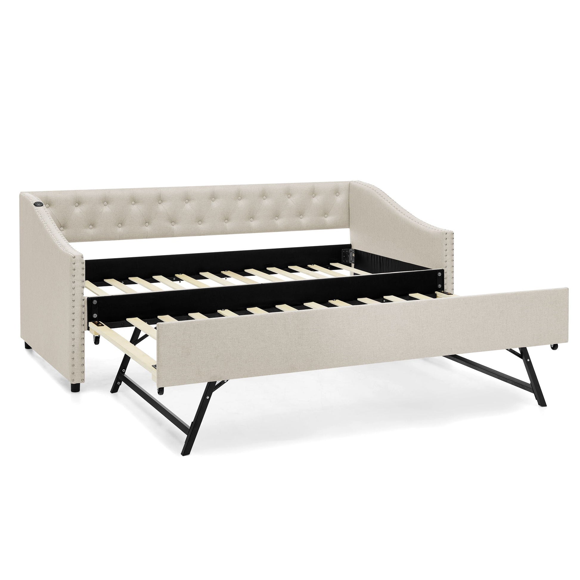 Beige upholstered daybed with tufted back and nailhead trim; pull-out trundle with wood slats on Tampa Home & Garden Store