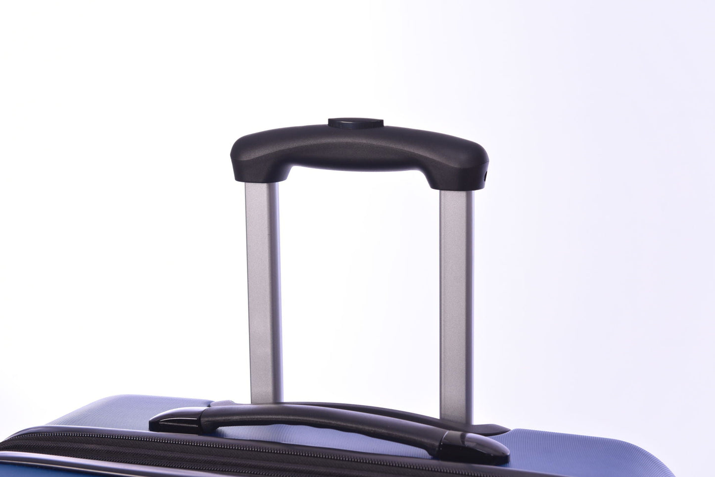 Luggage handle close-up on a blue hardside suitcase with black grip and silver rails on Tampa Home & Garden Store
