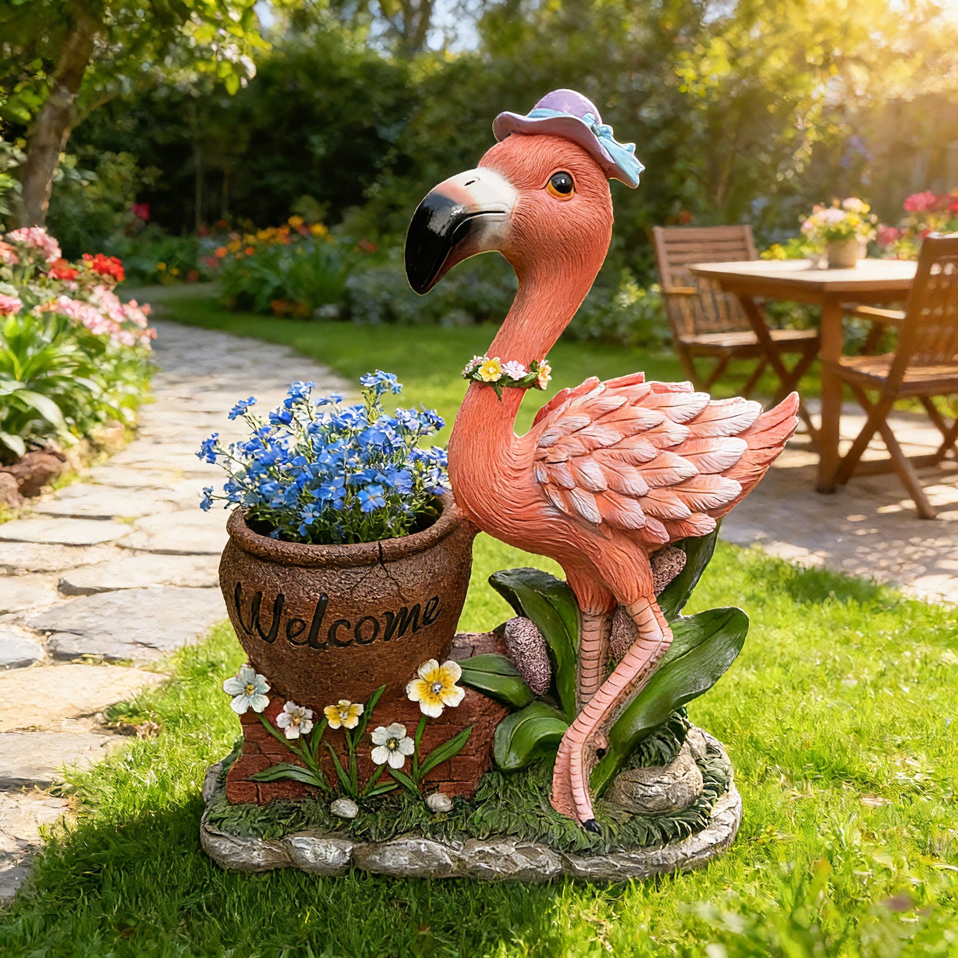 Outdoor flamingo flower pot planter statue in pink with floral accents on Tampa Home & Garden Store