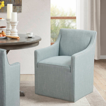Traditional skirted dining arm chairs in light blue fabric by HouseOfZazla with hidden casters on Tampa Home & Garden Store