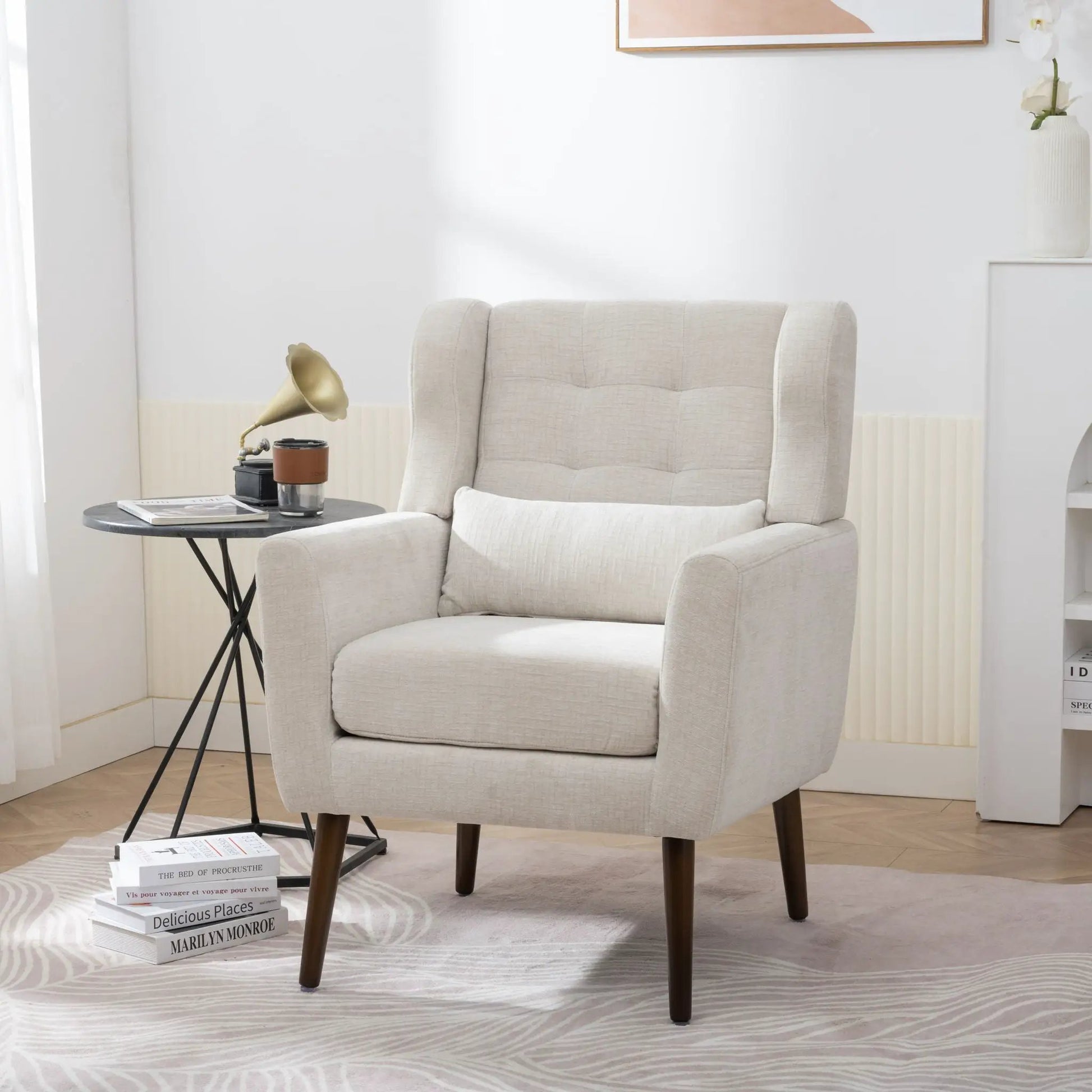 Modern accent chair in light beige fabric with foam-filled cushions and mid-century wooden legs on Tampa Home & Garden Store