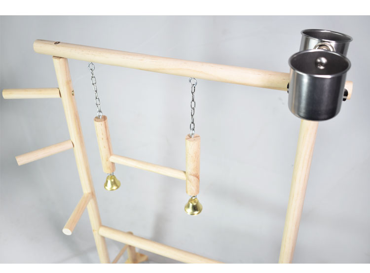 Solid wood toy swing ladder with two hanging blocks on chains and bells; stainless steel food bowls on natural wood frame on Tampa Home & Garden Store