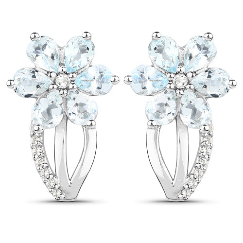 Earrings: pair of sterling silver flower earrings with aquamarine petals and topaz accents on Tampa Home & Garden Store