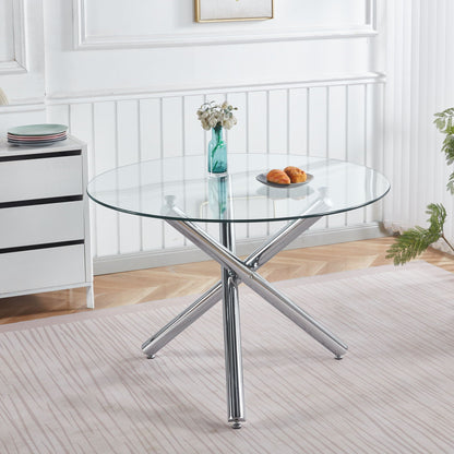 Dining Table round glass top with chrome cross legs in a white dining space, turquoise vase on Tampa Home & Garden Store