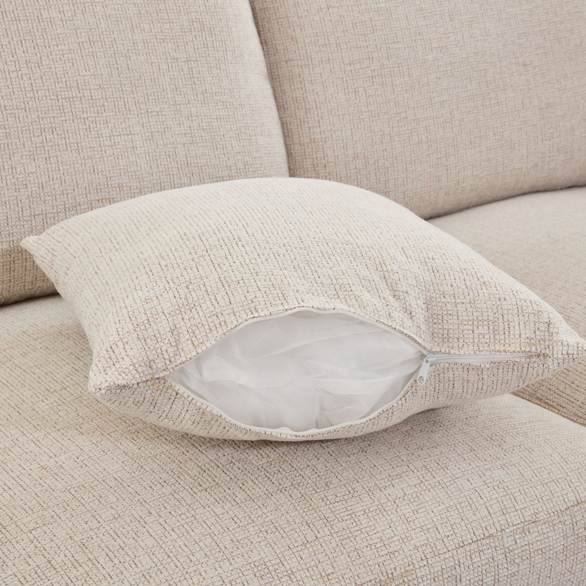 Beige textured sectional sofa cushion close-up with visible zipper; HouseOfZazla 2-piece set on Tampa Home & Garden Store