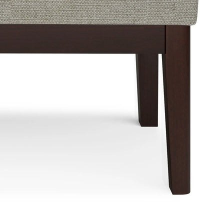 Carlson Ottoman Bench, beige textured upholstery, dark wood legs, mid-century design on Tampa Home & Garden Store