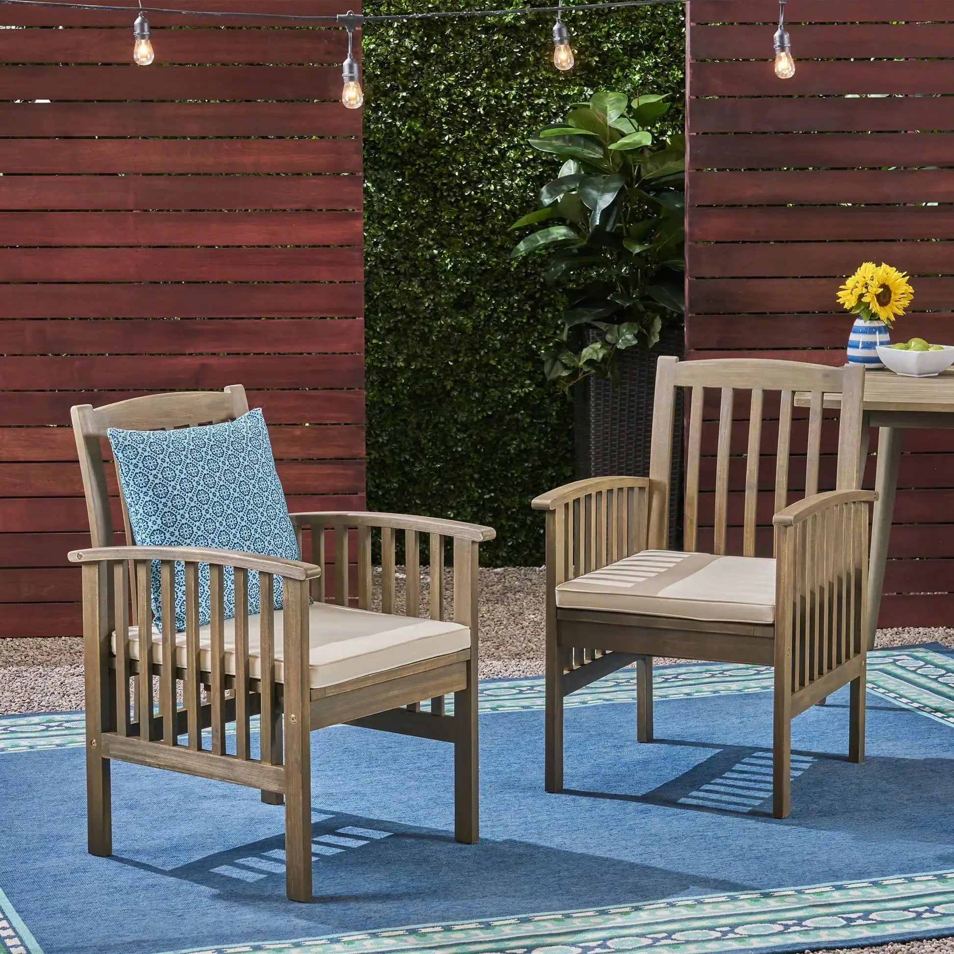 Casa Acacia outdoor dining chair set with blue patterned cushions on natural wood frames on Tampa Home & Garden Store