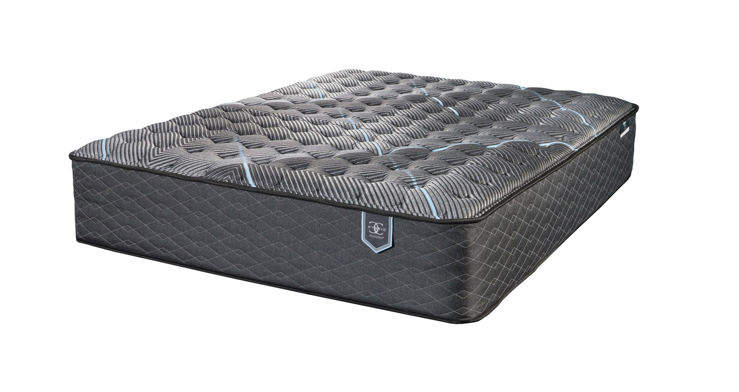 Restonic ComfortCare Hybrid firm twin XL mattress with dark gray quilted cover and blue accents on Tampa Home & Garden Store