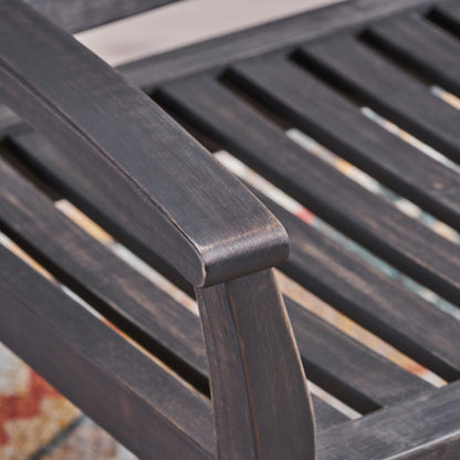 Baxter Rocking Loveseat dark gray wood slats curved armrest close-up outdoor bench on Tampa Home & Garden Store