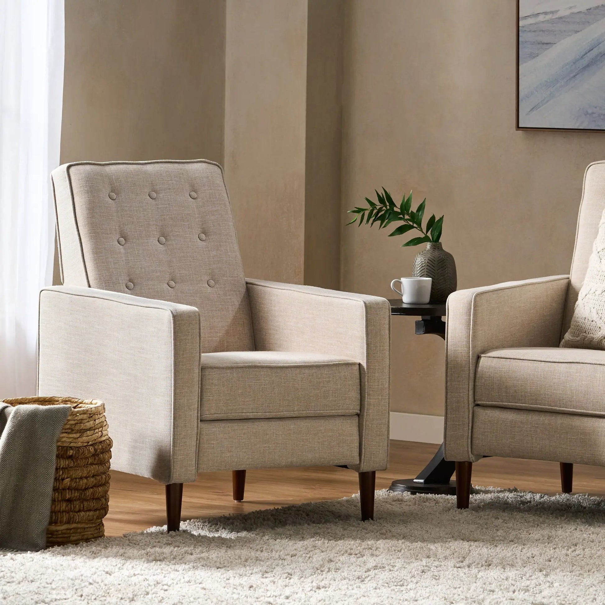 Two Mid-Century Modern reclining chairs in beige fabric with button tufting and dark wood legs on Tampa Home & Garden Store