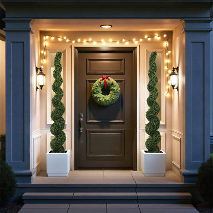 7FT Spiral Topiary Trees faux boxwood in planters flanking a dark door with wreath and lights on Tampa Home & Garden Store