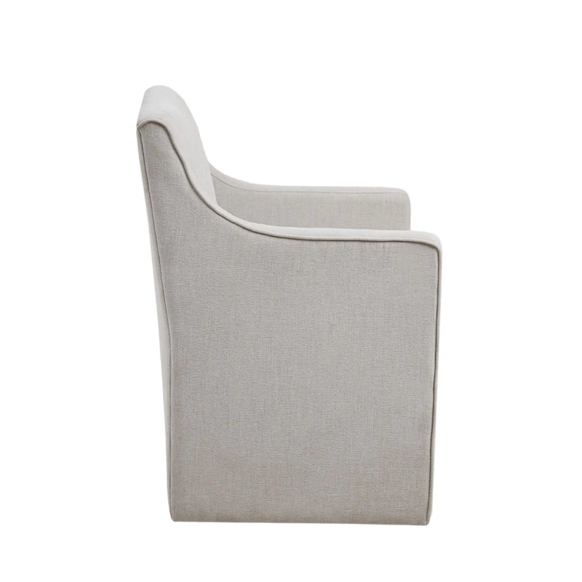 Traditional skirted dining arm chair with light beige textured fabric and curved arms on Tampa Home & Garden Store