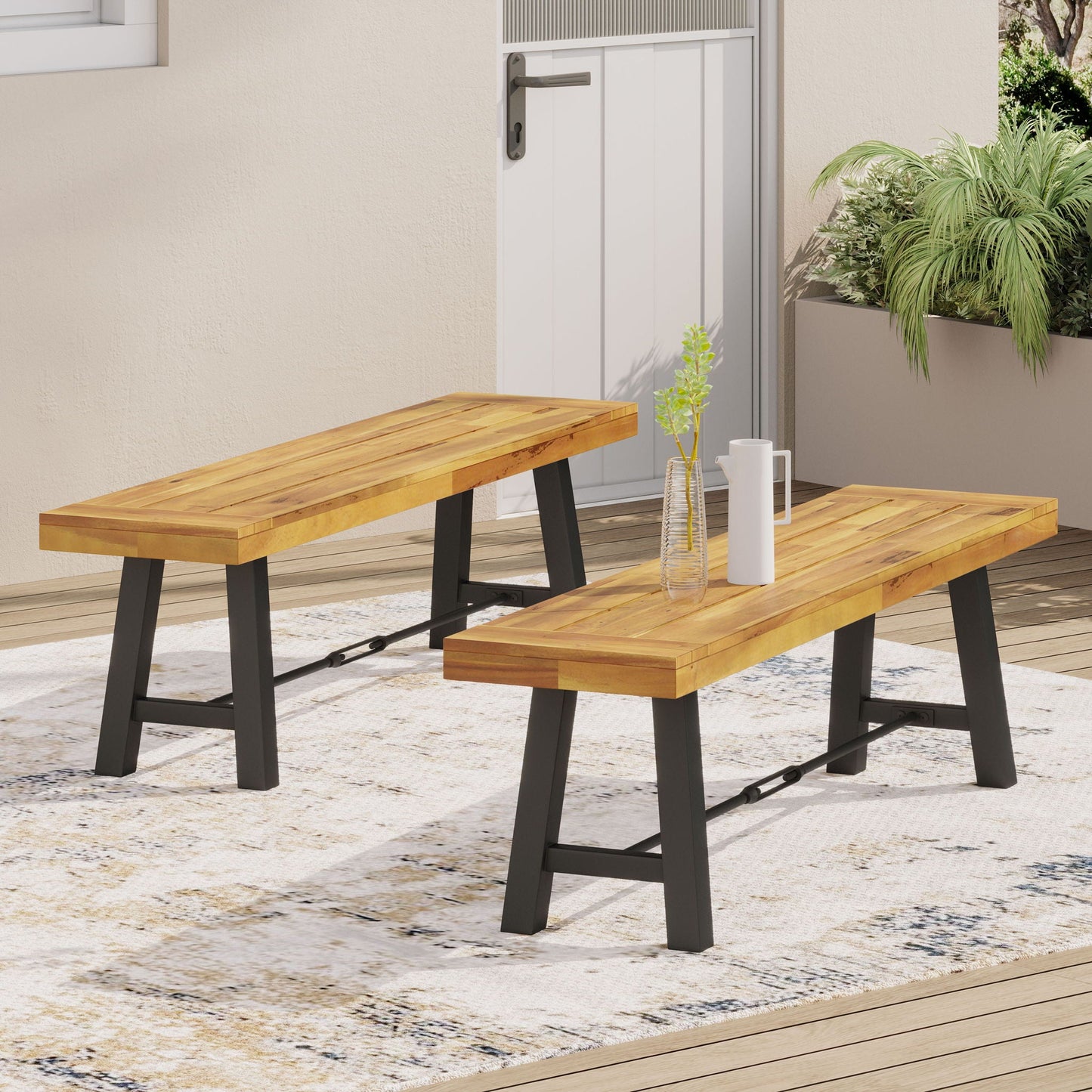 Catriona teak bench by HouseOfZazla with black metal legs, two outdoor benches on a deck on Tampa Home & Garden Store