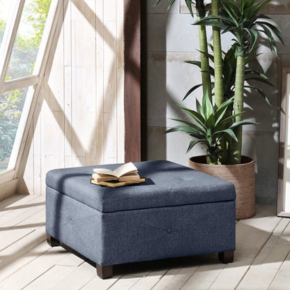 Aspen storage ottoman with soft-close lid in blue fabric and dark wood legs on Tampa Home & Garden Store