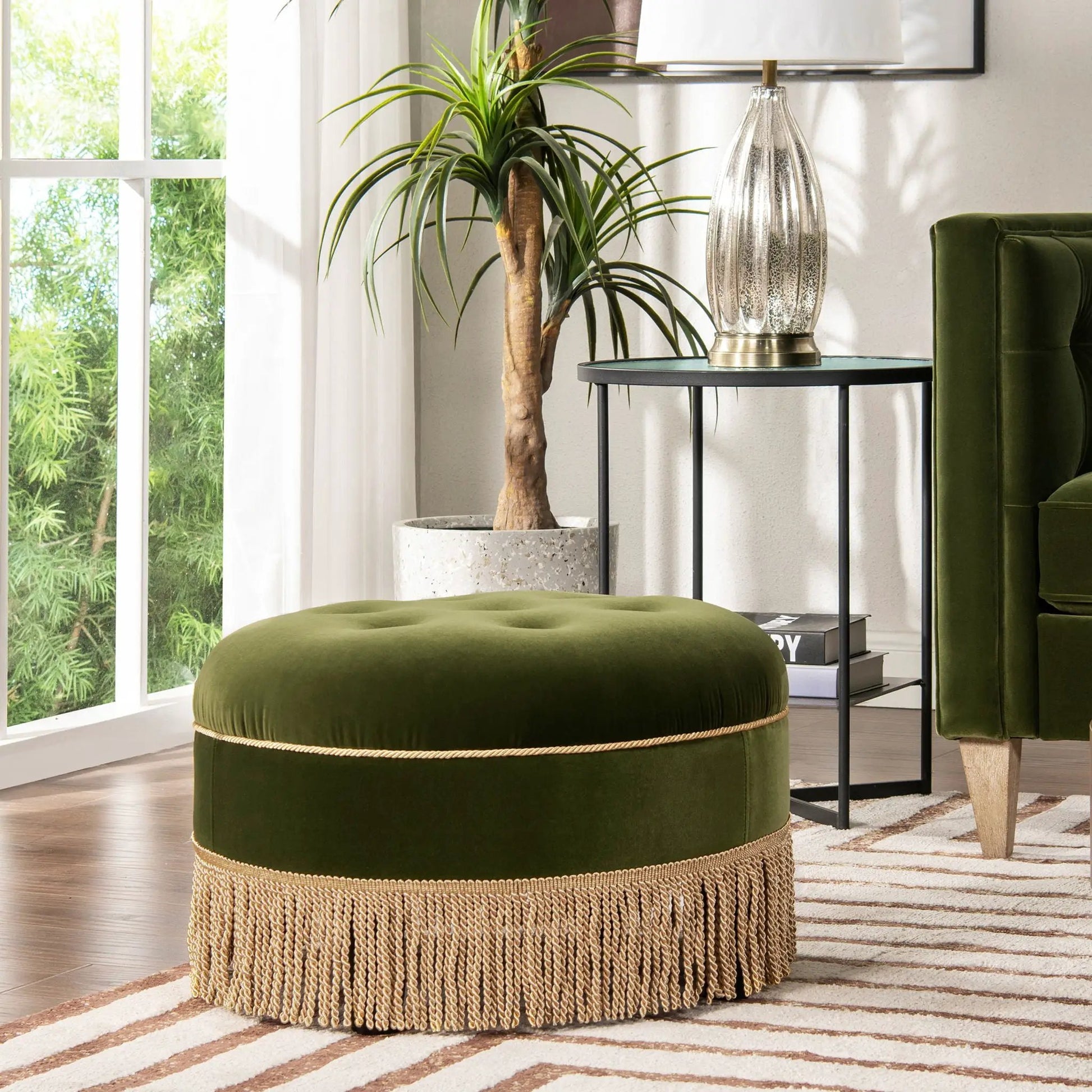 Yolanda round upholstered accent ottoman in emerald green velvet with natural jute fringe base on Tampa Home & Garden Store