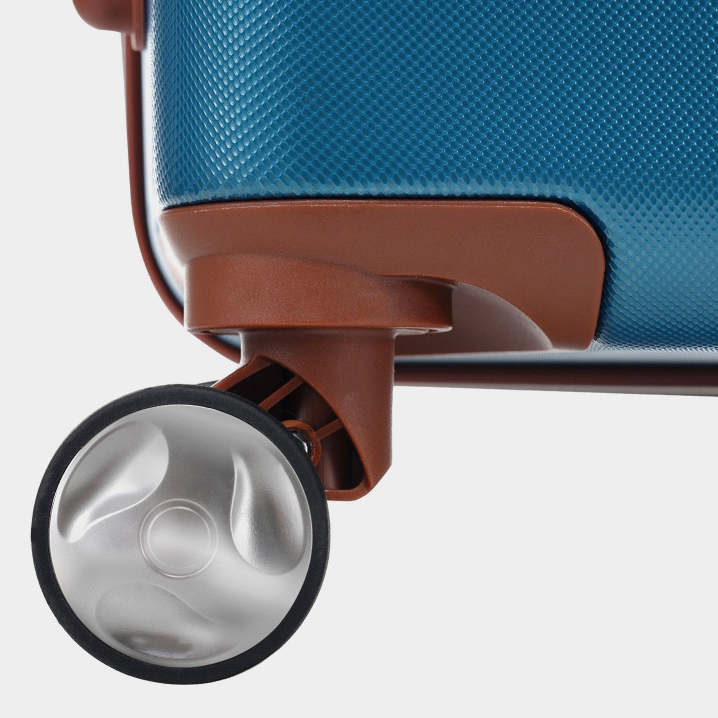 GigaTech blue hard-shell luggage close-up with textured surface, brown trim, and silver wheel on Tampa Home & Garden Store