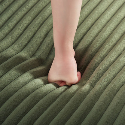 Upholstered U-Shaped Sectional Sofa olive green ribbed fabric closeup with a bare leg on Tampa Home & Garden Store