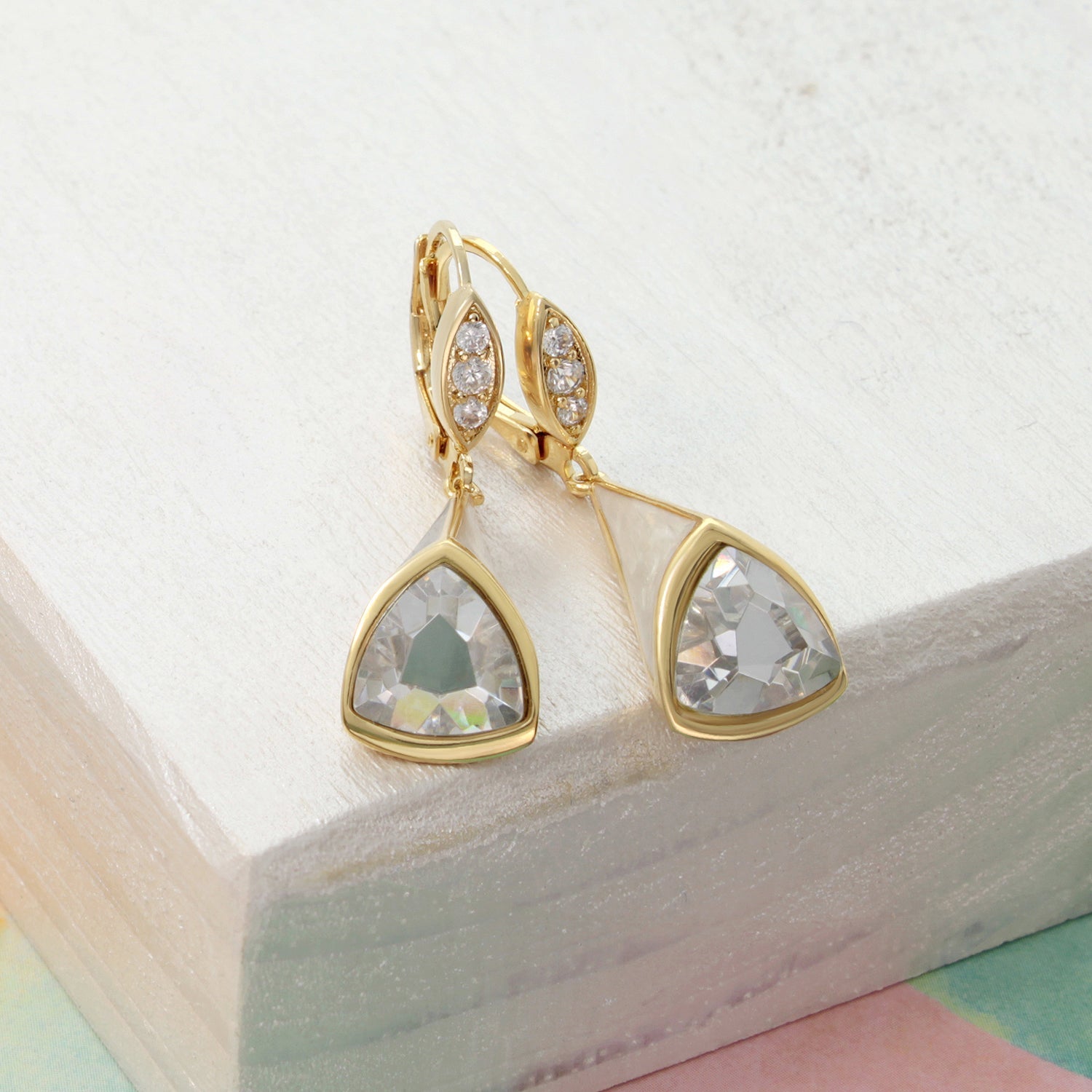 Pair of triplet earrings gold-tone with leaf motif and pavé diamonds; triangular crystal drops on Tampa Home & Garden Store