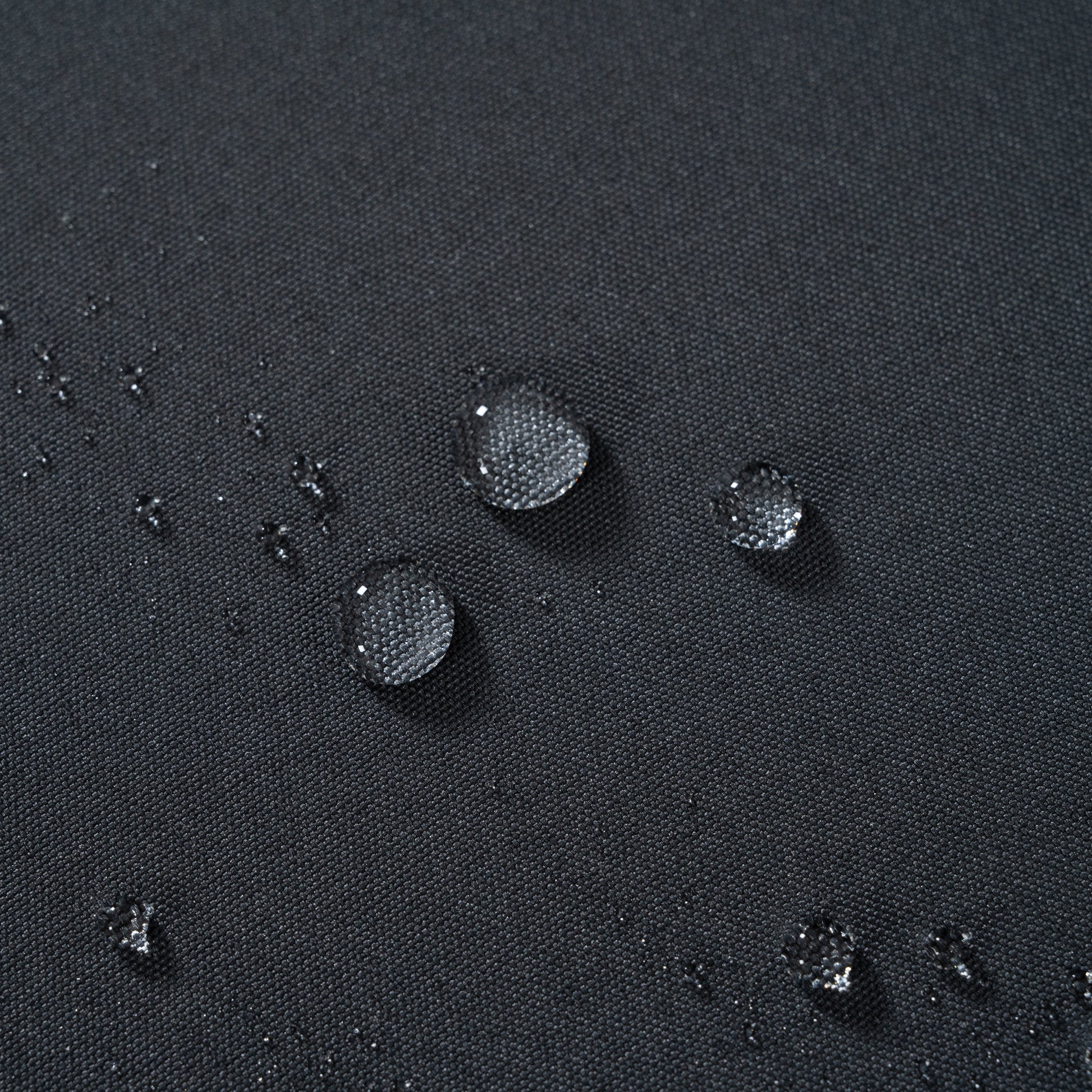 Outdoor sofas dark charcoal grey fabric closeup with water droplets on Tampa Home & Garden Store