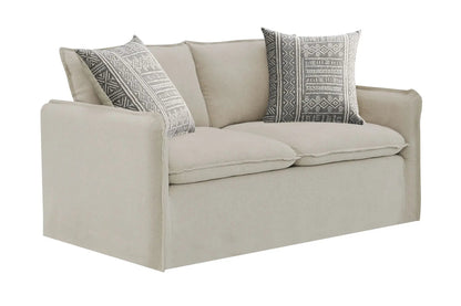 Upendo pattern linen sofa beige with two grey geometric toss pillows on Tampa Home & Garden Store