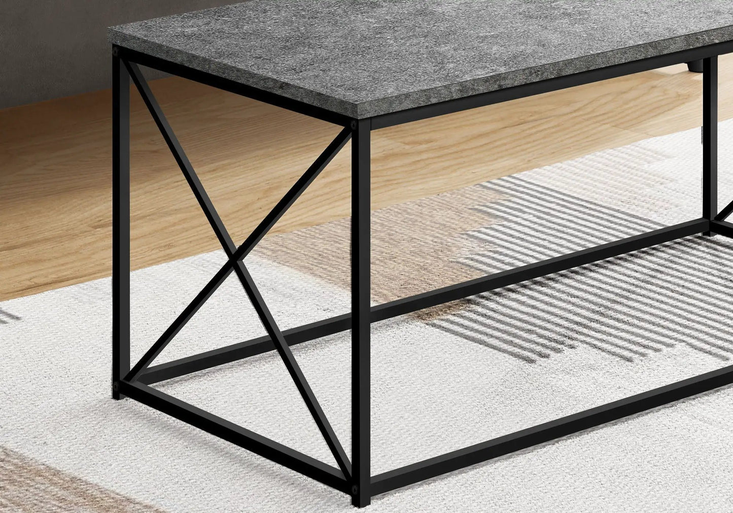 Rectangular coffee table with black metal frame and textured top by Unique Piece Furniture on Tampa Home & Garden Store