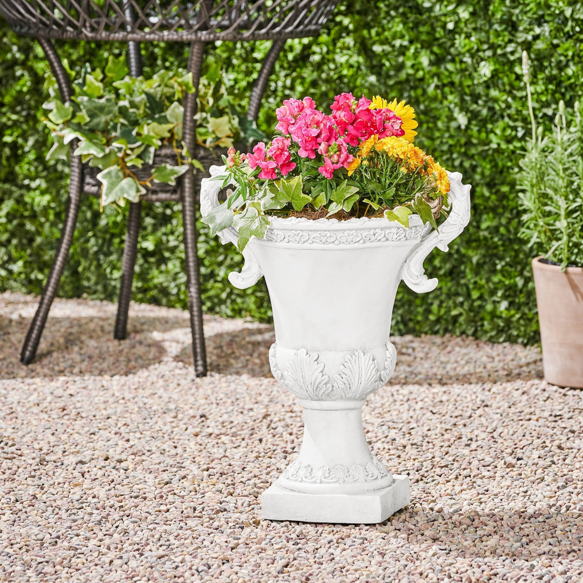 Roman Style MGO Garden Urn Planter in white with ornate detailing and flowers on Tampa Home & Garden Store