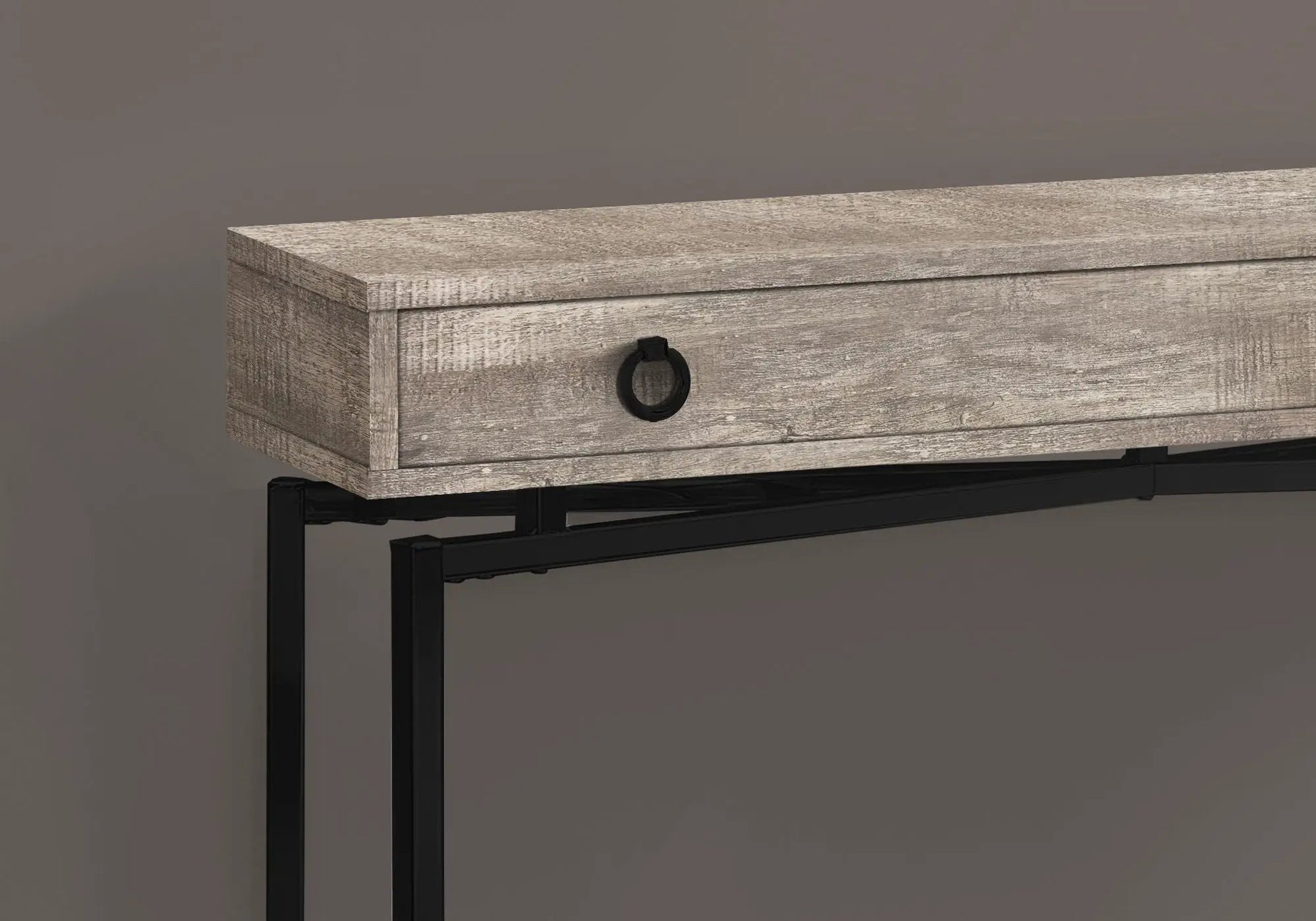 Accent console table in weathered gray wood with a storage drawer and black ring pull on Tampa Home & Garden Store