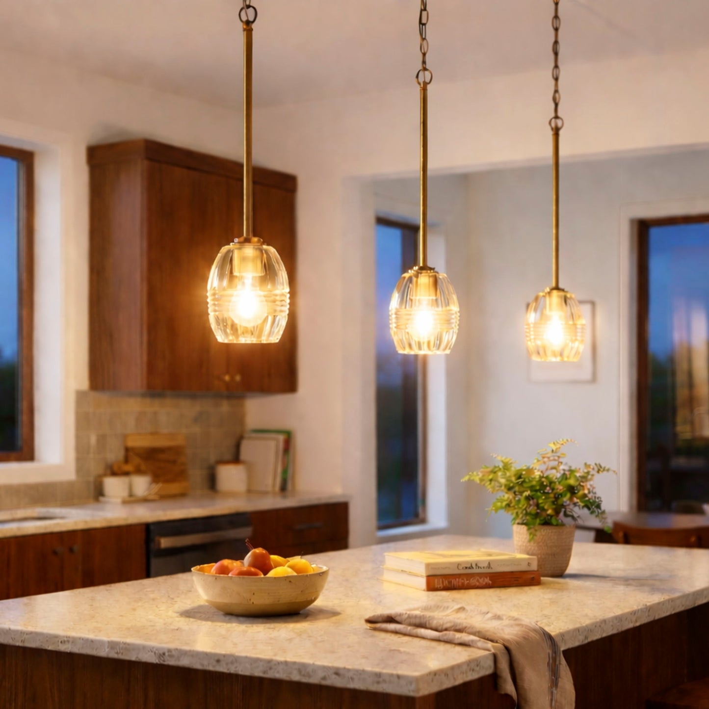 Vista pendant lights set of four with clear glass shades and gold finish over a kitchen island on Tampa Home & Garden Store