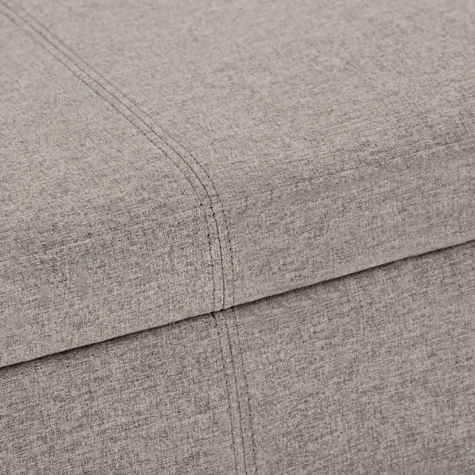 Avalon storage ottoman bench by Unique Piece Furniture in light gray upholstery close-up on Tampa Home & Garden Store