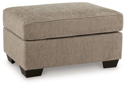 Olten ottoman by Unique Piece Furniture in beige textured fabric with dark wood legs on Tampa Home & Garden Store