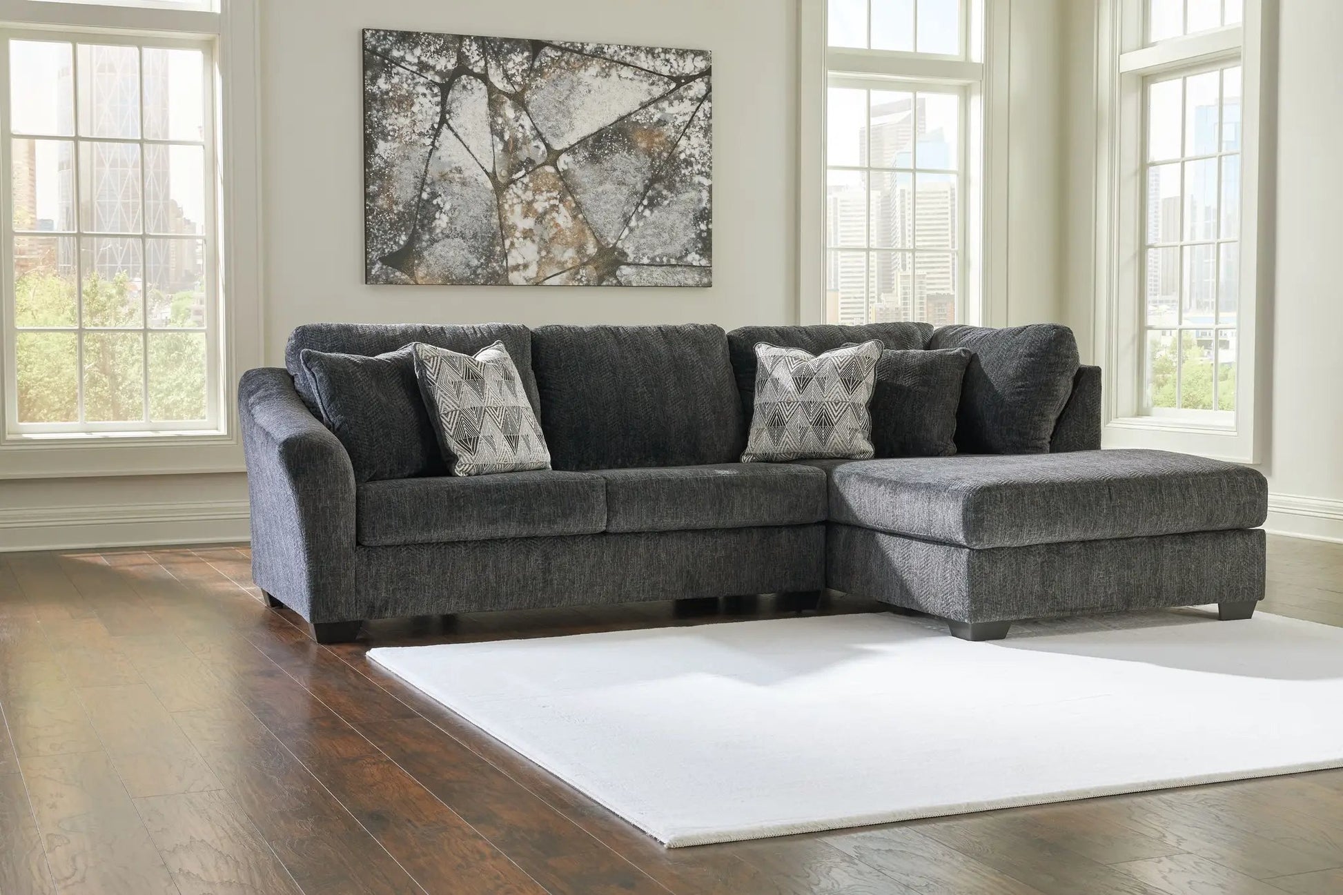 Biddeford Stationary Sectional in charcoal fabric with two geometric pillows by Unique Piece on Tampa Home & Garden Store