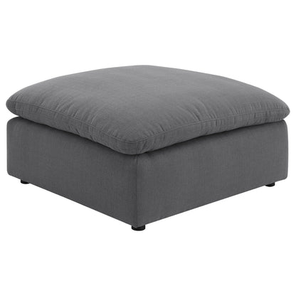 Charcoal gray upholstered ottoman cushion with stitched edges and textured fabric on Tampa Home & Garden Store
