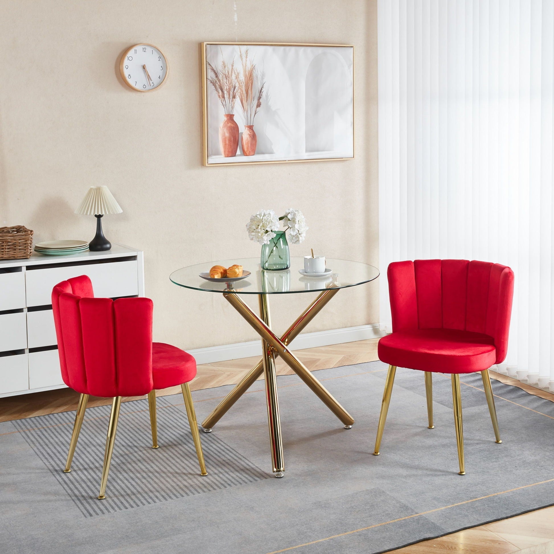Ergonomic dining chair set of 2 in red velvet with gold legs around a glass round table on Tampa Home & Garden Store
