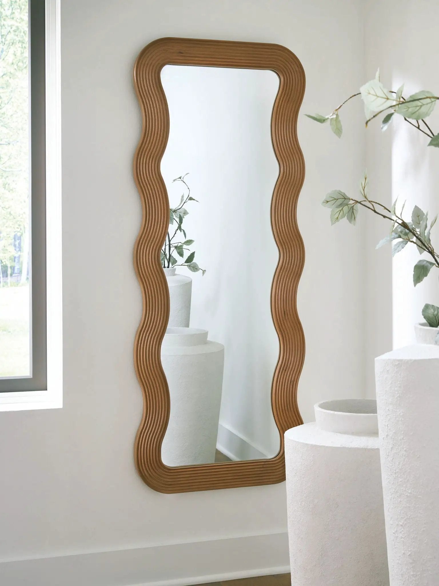 Ellisonville brown floor mirrors by Unique Piece Furniture pair with ribbed wavy frames on wall on Tampa Home & Garden Store