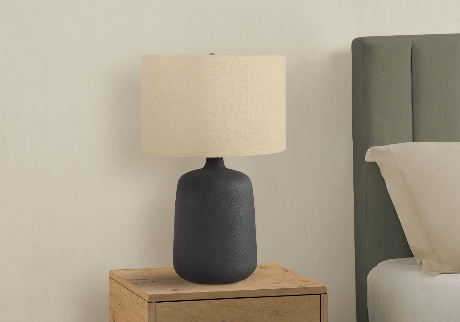 Table lamp contemporary black ceramic base with beige fabric shade on wooden nightstand on Tampa Home & Garden Store