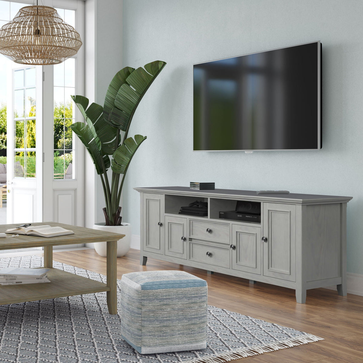 Wide TV Stand in solid wood with a gray finish and multiple drawers supporting a Samsung TV on Tampa Home & Garden Store