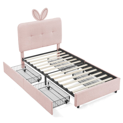 Twin size kids upholstered bed with bunny ear headboard in blush pink and under-bed baskets on Tampa Home & Garden Store