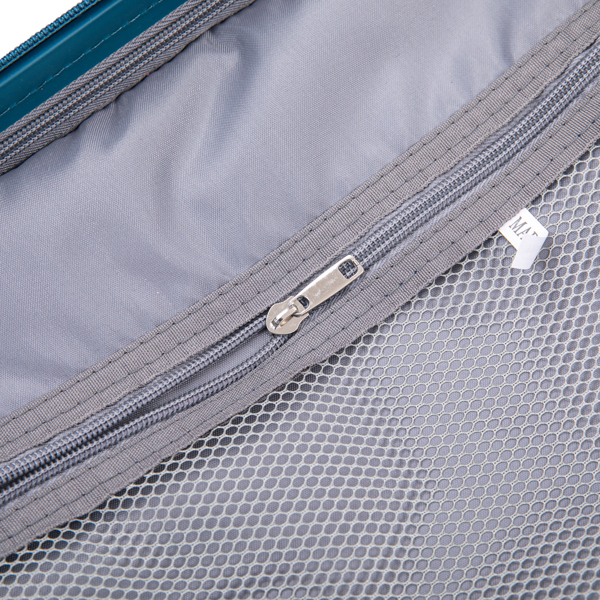 HouseOfZazla hard case luggage interior close-up with gray lining and blue zipper trim on Tampa Home & Garden Store
