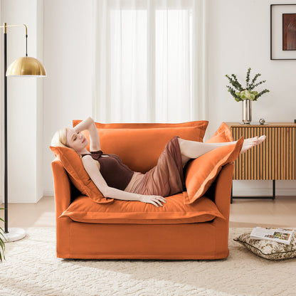 Slip-Covered Armchair with Cushions in orange fabric by HouseOfZazla in a sunlit living room with a brass lamp on Tampa Home & Garden Store