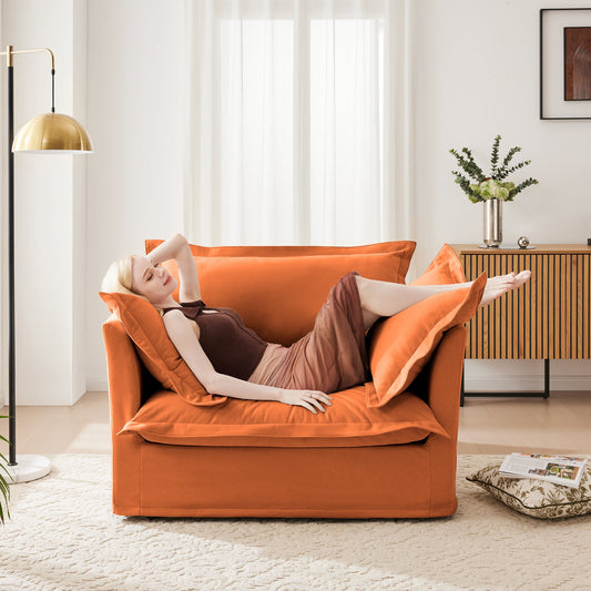 Slip-Covered Armchair with Cushions in orange fabric by HouseOfZazla in a sunlit living room with a brass lamp on Tampa Home & Garden Store