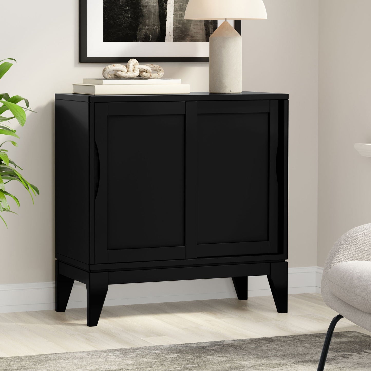Harper Low Storage Cabinet Black with clean lines top two books and knot sculpture on Tampa Home & Garden Store
