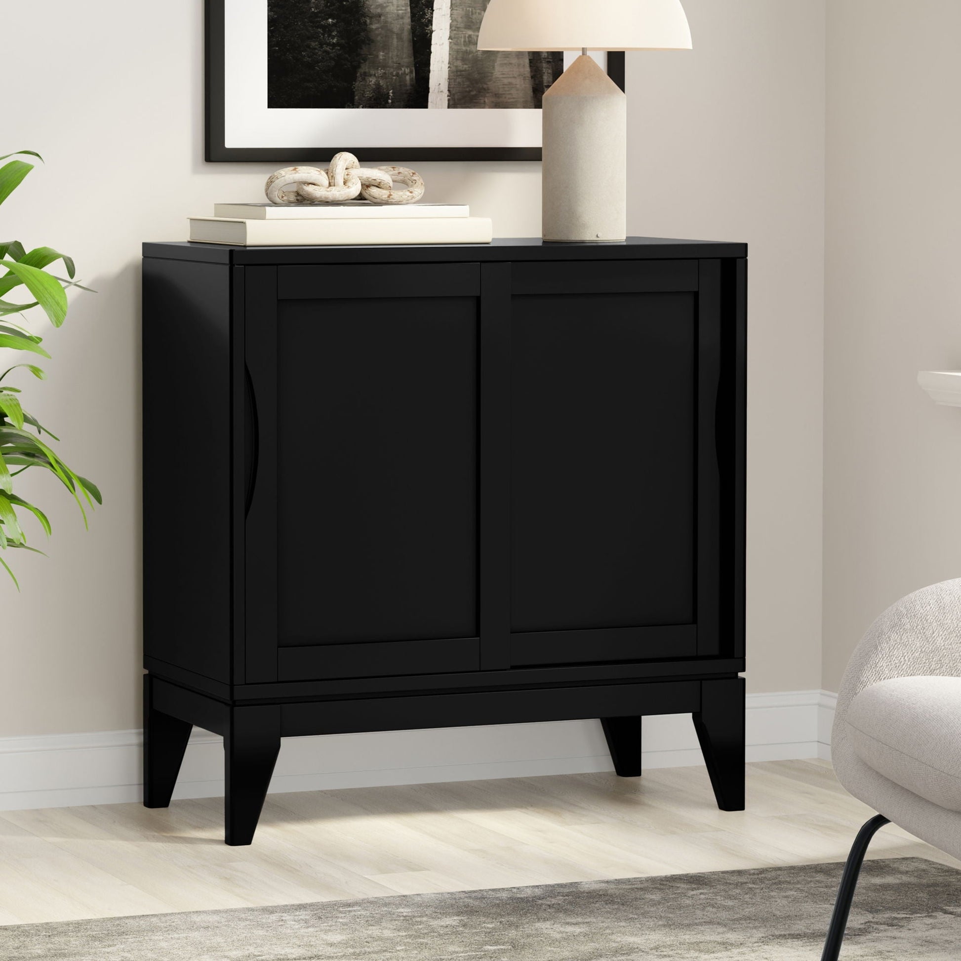 Harper Low Storage Cabinet Black with clean lines top two books and knot sculpture on Tampa Home & Garden Store