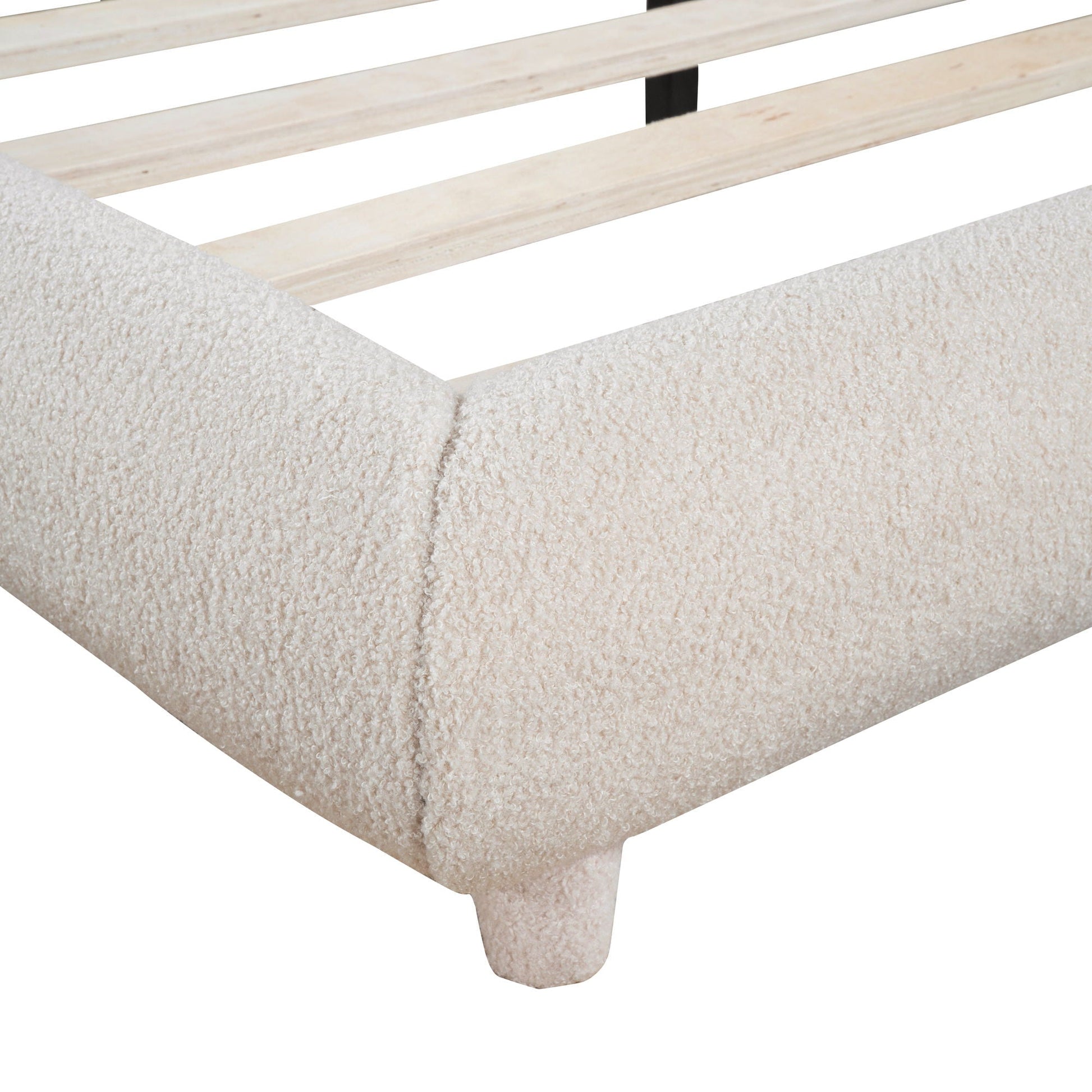 Upholstered platform bed with thick wood frame and curved leg in beige fabric on Tampa Home & Garden Store