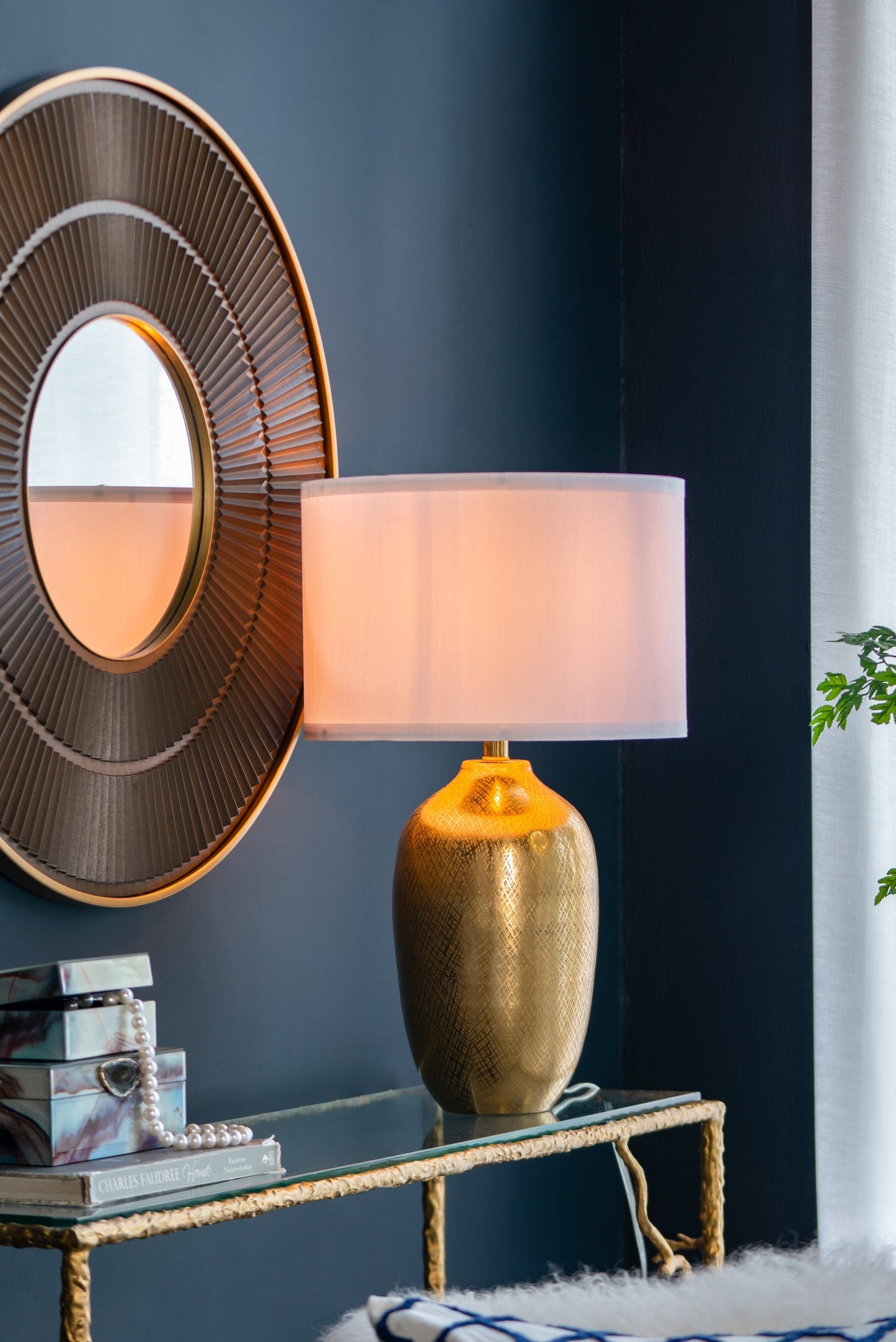 D15x25.7' Gold aluminum table lamp with white shade beside a round gold mirror HouseOfZazla on Tampa Home & Garden Store